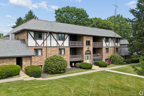 A large house with a balcony and a covered patio.