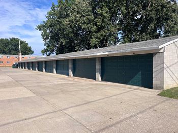 A long row of garage doors are closed.