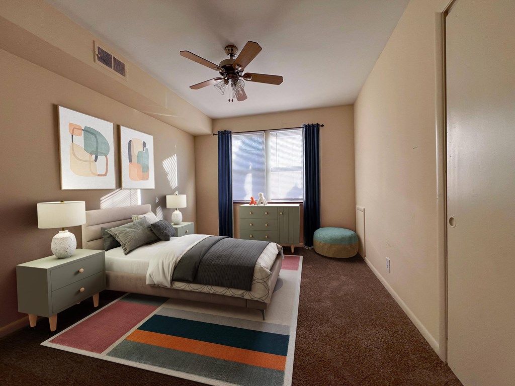 a bedroom with a bed and a ceiling fan