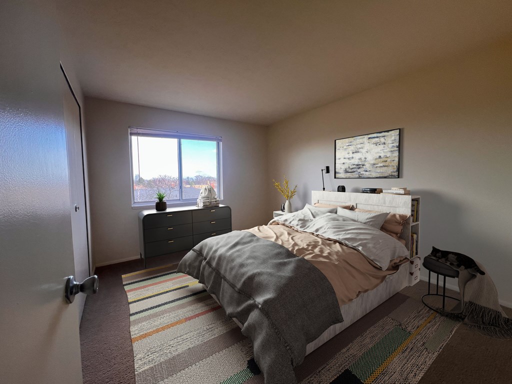 a bedroom with a bed and a window