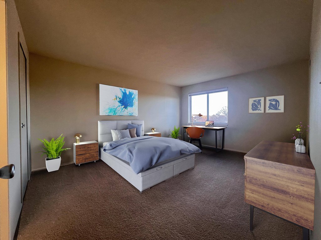a bedroom with a bed and a desk and a window