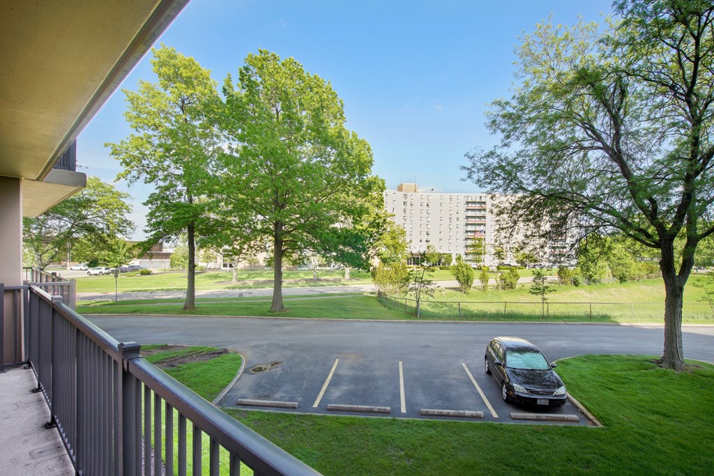 A car is parked in a parking lot at Independence Place Apartments, Parma Heights, Ohio