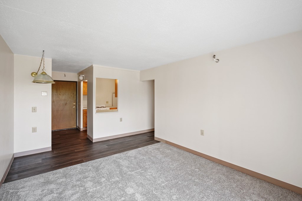 A room with a grey carpet and white walls at Independence Place Apartments, Parma Heights, 44130