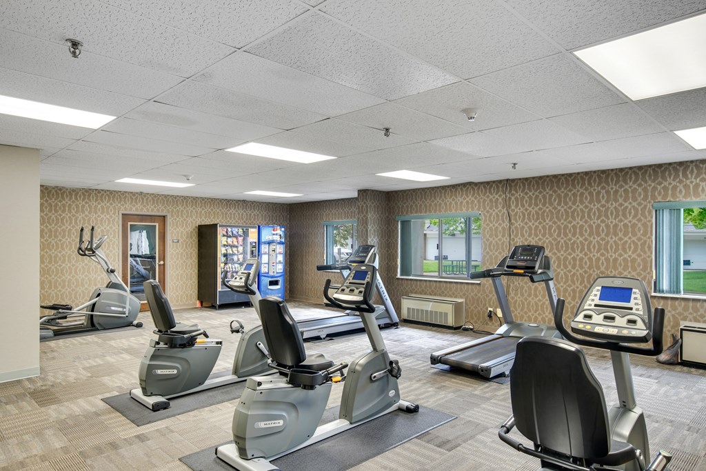 A gym with treadmills and elliptical machines at Independence Place Apartments, Parma Heights, OH 44130