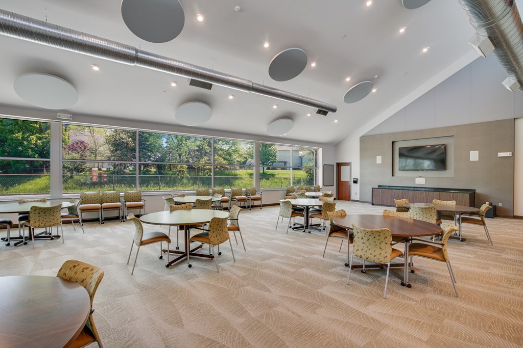 A conference room with a long table and chairs at Independence Place Apartments, Parma Heights, OH