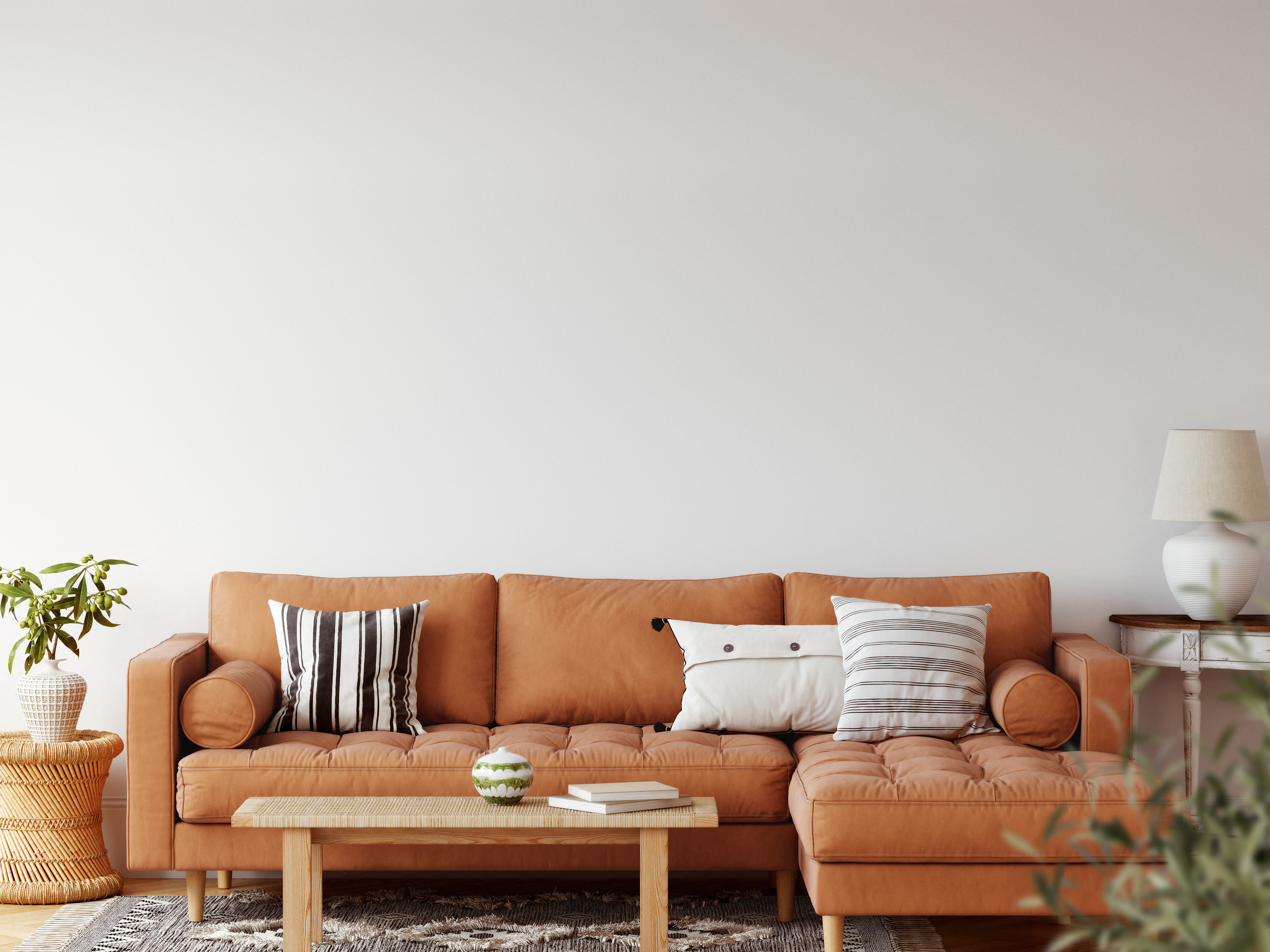 a living room with a brown couch and a coffee table