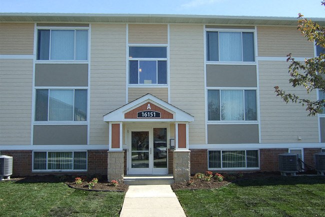 The front of apartment building number 16151 is shown.