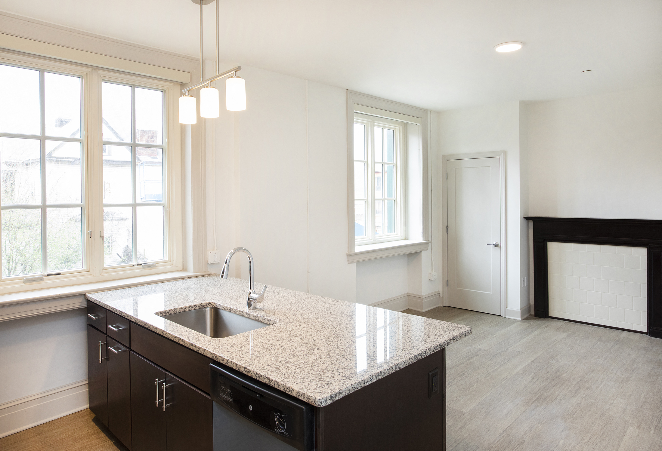 A kitchen with a sink and a window.