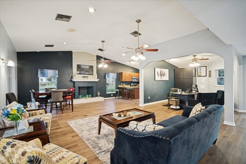 A living room with a dark blue couch and a coffee table.