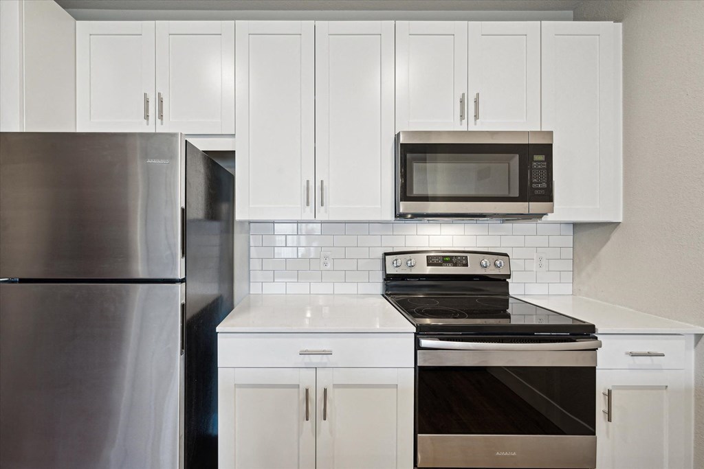 Kitchen with White Cabinetry and Stainless Steel Appliances