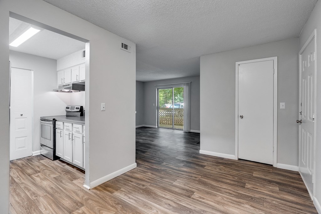 Kitchen With White Cabinetry, Brushed Nickel Hardware & Stainless Steel Appliances
