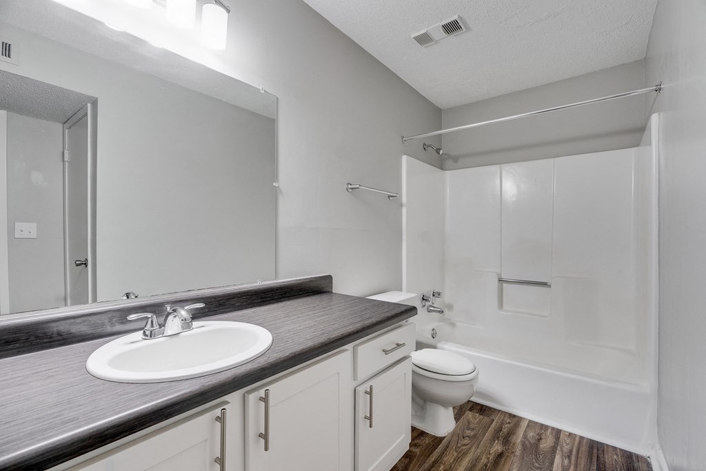 Bathroom With Wood-Style Flooring & Shower With Tub