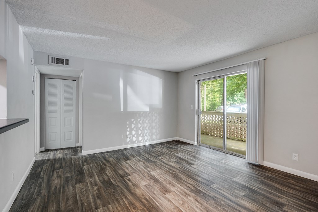 Living Room Area With Peek Through Window  To The Kitchen