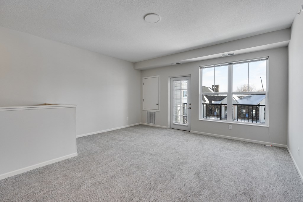 Living Room With Outdoor Balcony