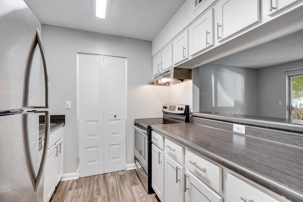 Galley Kitchen With White Cabinetry & Brushed Nickel Hardware