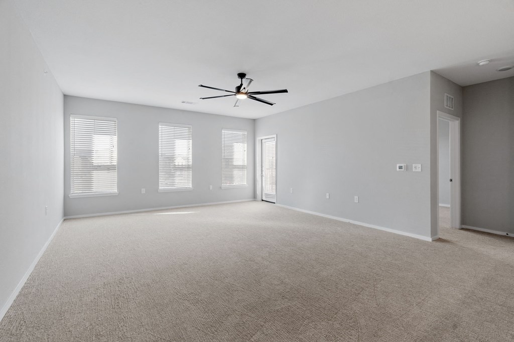 Spacious Living Area with Carpet
