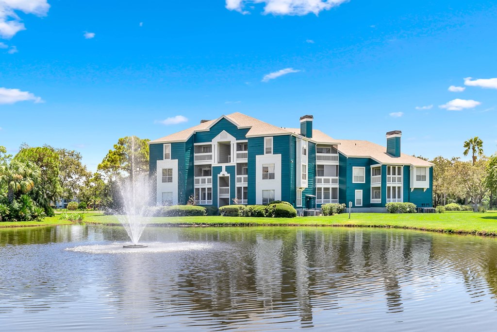Large Pond & Fountain With Apartment Homes Overlooking