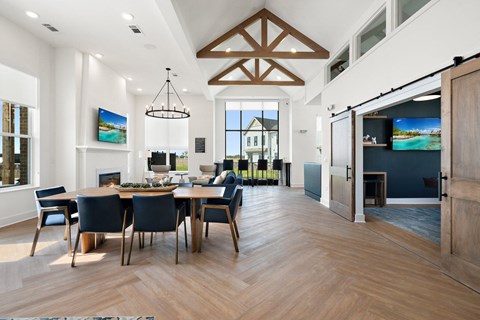 a dining room and living room with a table and chairs