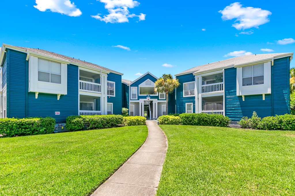 Lush Greenery & Grounds In Front Of Apartment Homes