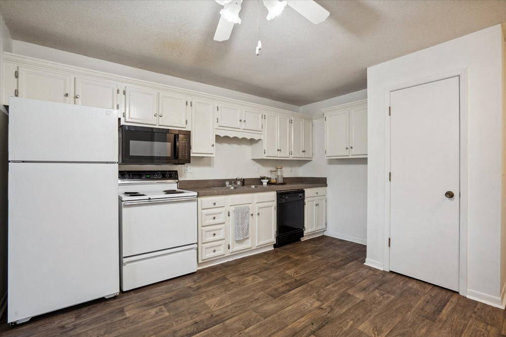 Fully Equipped Kitchen with White Appliances