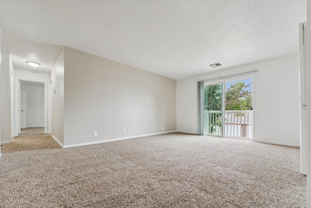 Spacious Living Area with Balcony Access