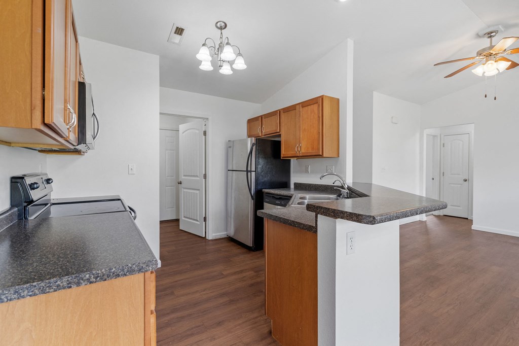 Fully-Equipped Kitchen with Black Appliances