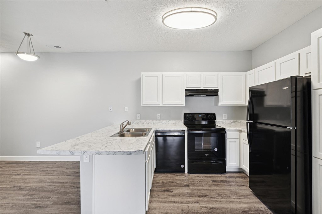 Fully-Equipped Kitchen with Black Appliances