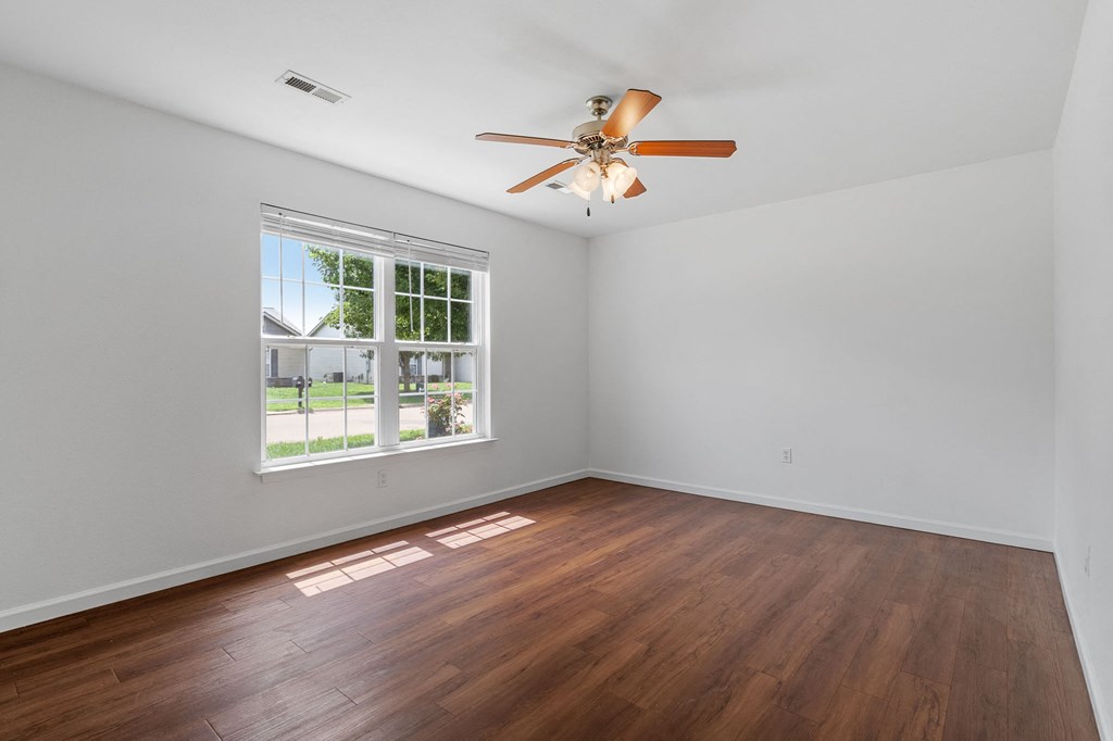 Large Bedroom with Wood-Style Flooring