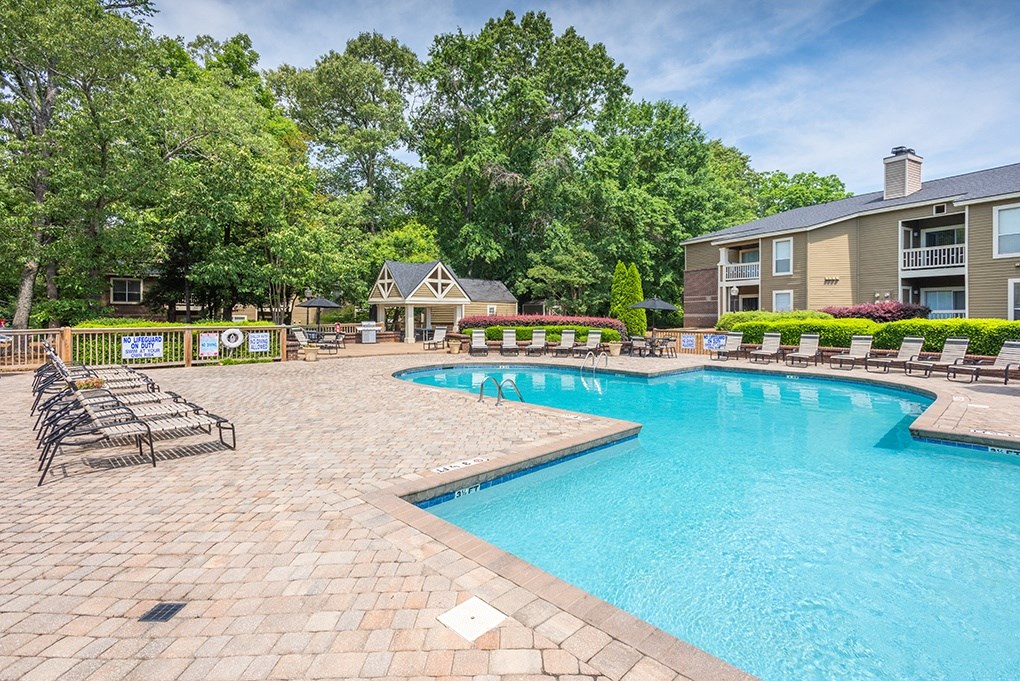 Spacious Pool Sundeck With Brick Pavers & Lounge Chairs