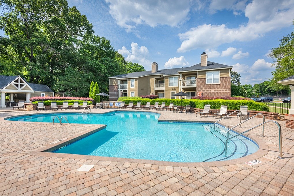 Outdoor Pool & Sundeck With Lush Landscaping