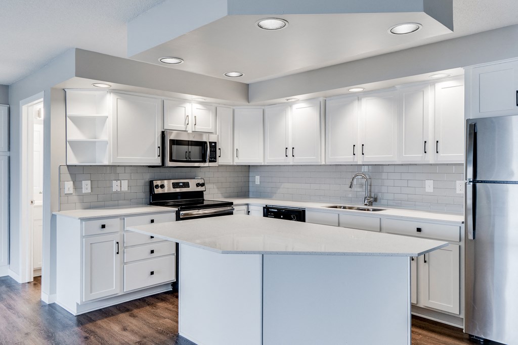 Large Kitchen with Recessed Lighting and Stainless Steel Appliances