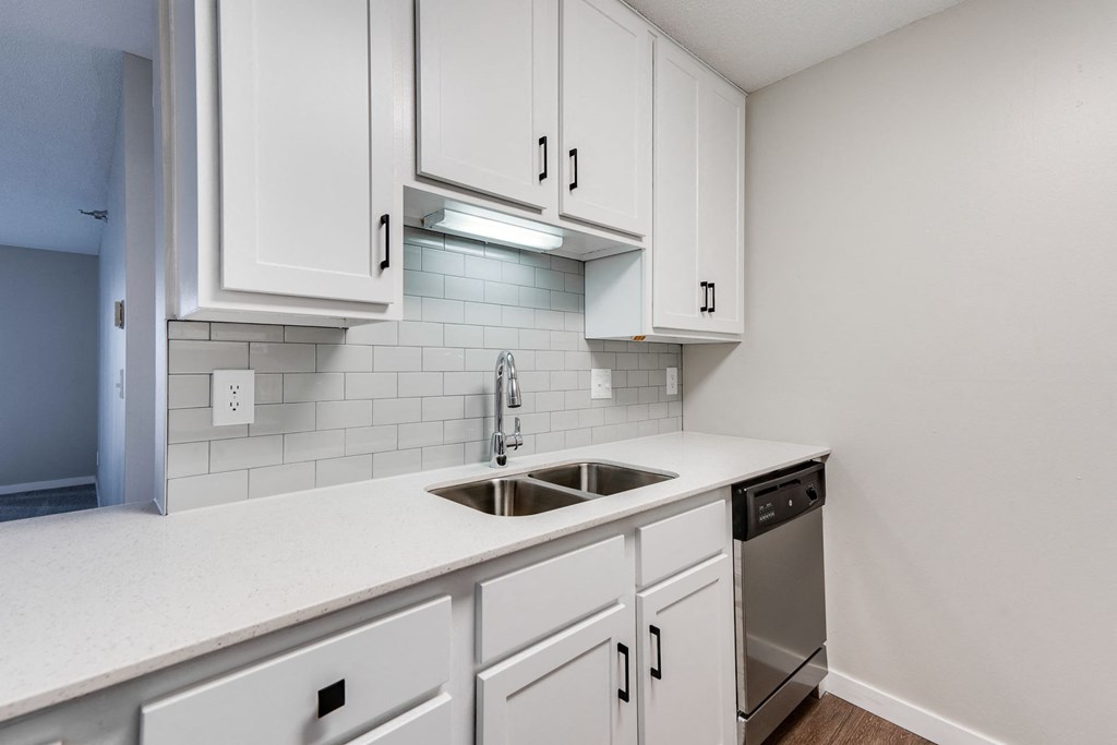 Kitchen with White Cabinetry and Subway Tile Backsplash