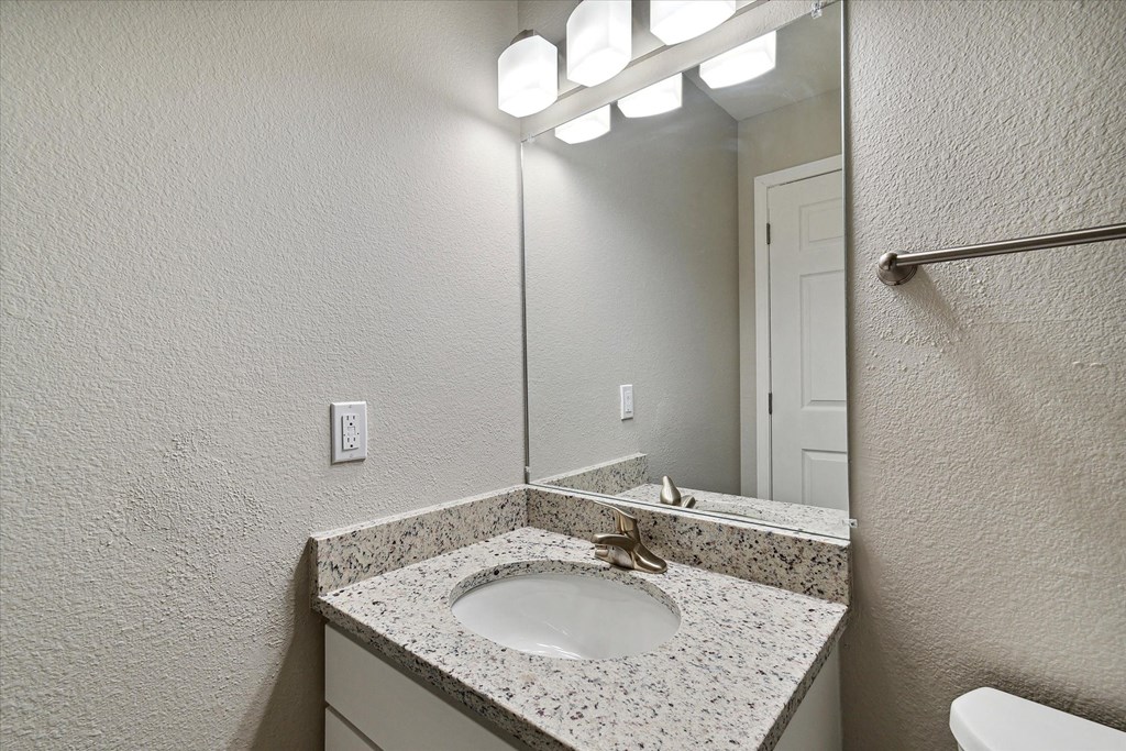 Bathroom With Granite Vanities