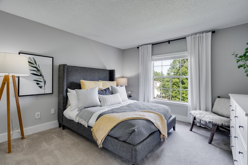 Carpeted Bedroom With Large Windows