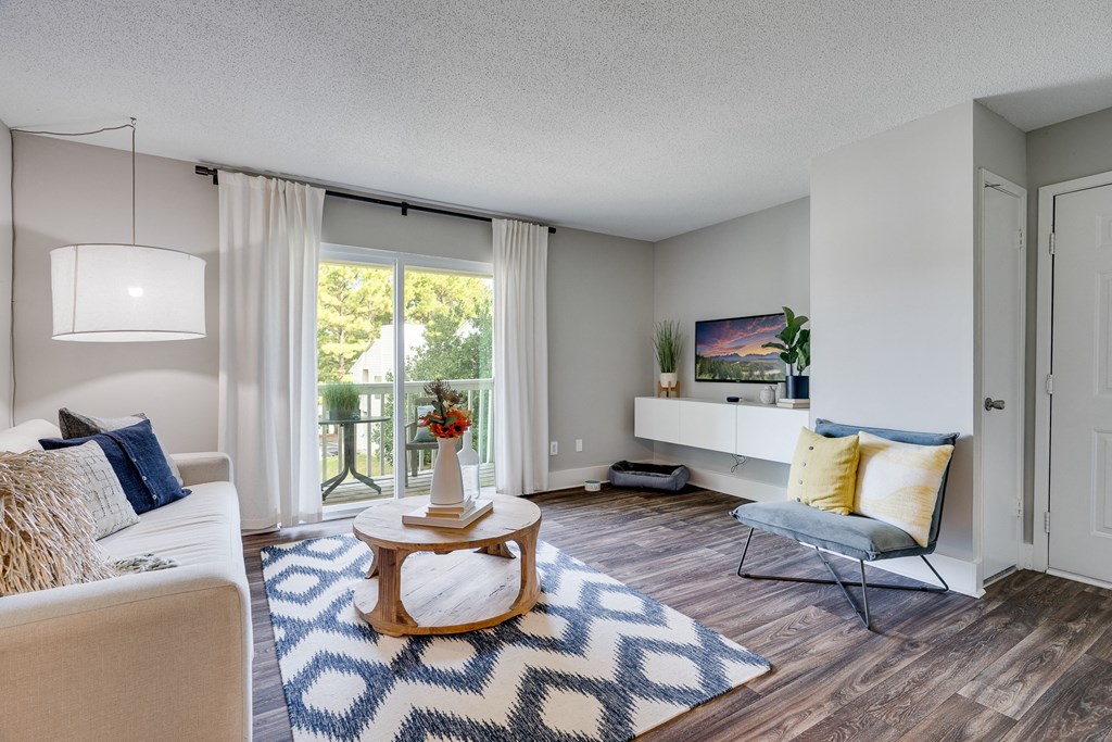 Living Room With Wood-Style Flooring & Light Grey Walls