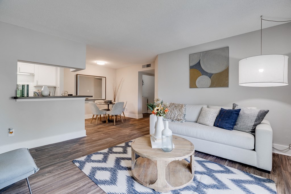 Open-Concept Kitchen, Dining, & Living Room With Wood-Style Flooring