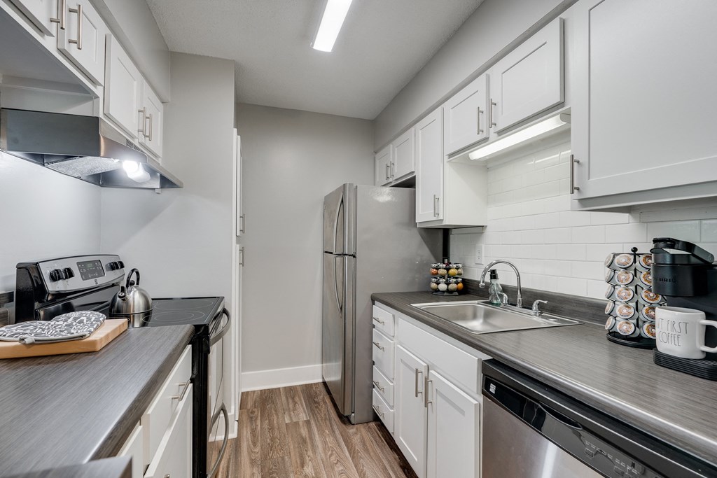 Kitchen With White Cabinetry & Stainless Steel Appliances