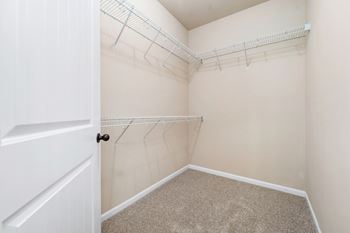 Walk-In Closet With Built-In Shelving