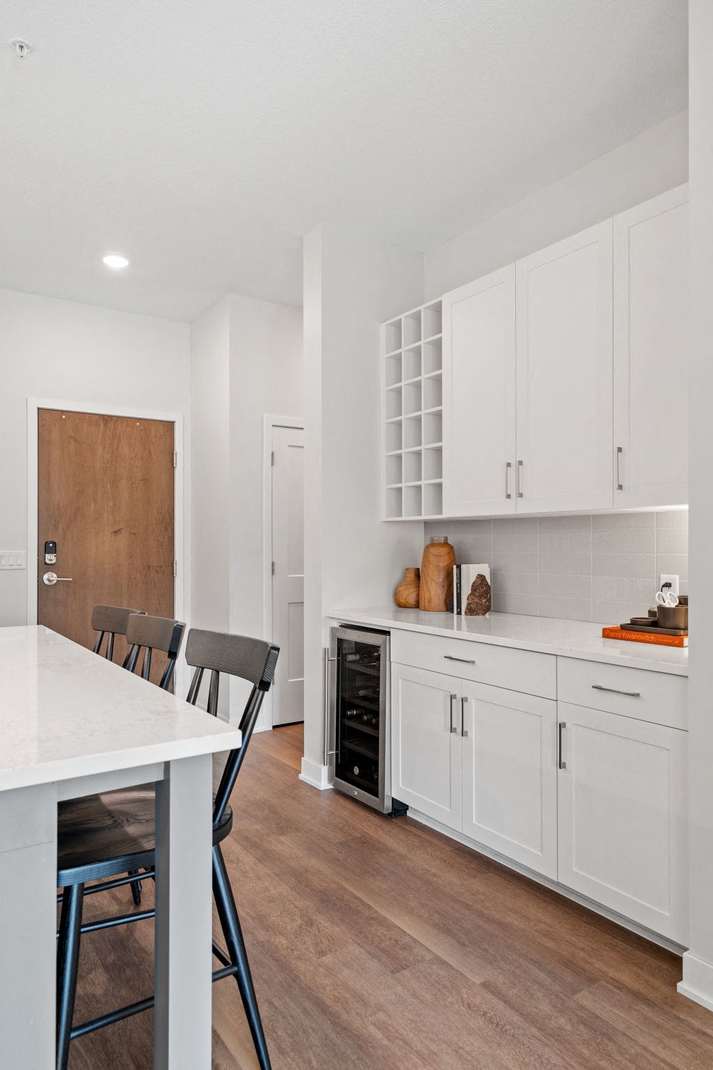 Kitchen Featuring Built-In Buffet & Wine Rack