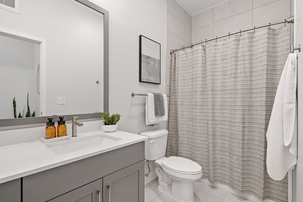 Bathroom Featuring Tiled Floor & Shower