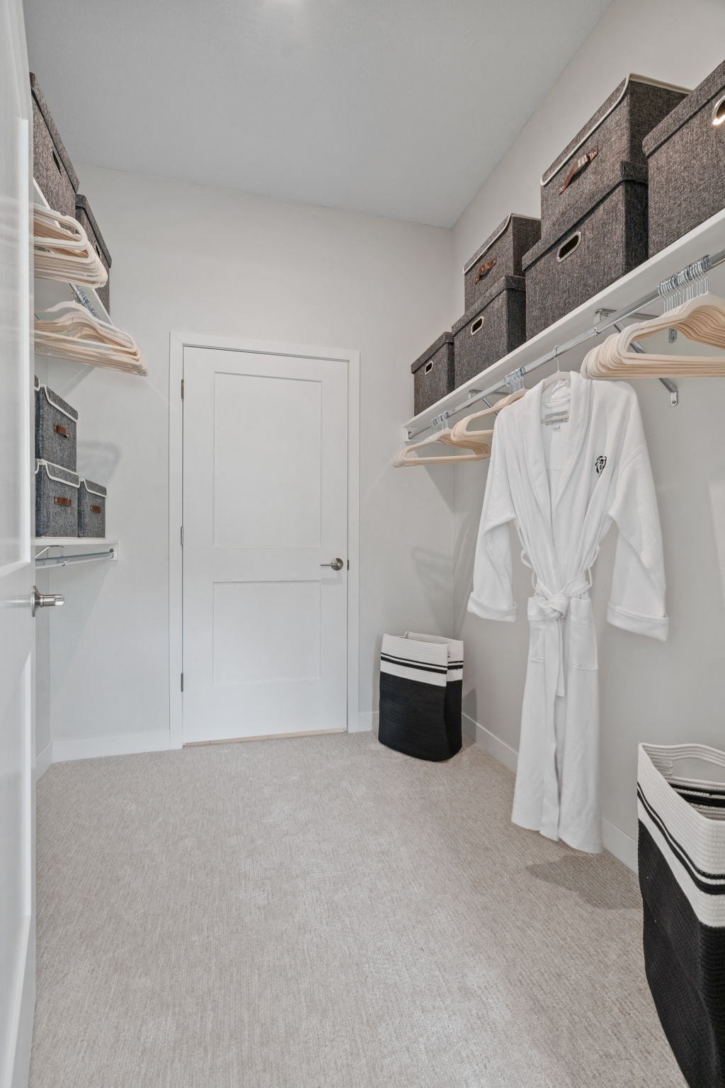 Expansive Walk-In Closet Leading To Bathroom
