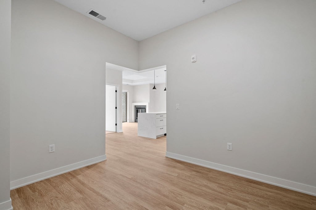 Den Area with Wood-Style Flooring