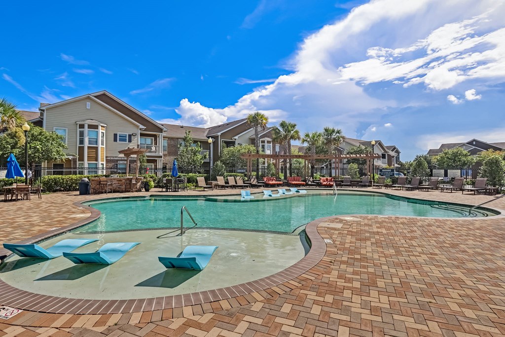 Zero-Entry Pool With Sun Lounger Chairs