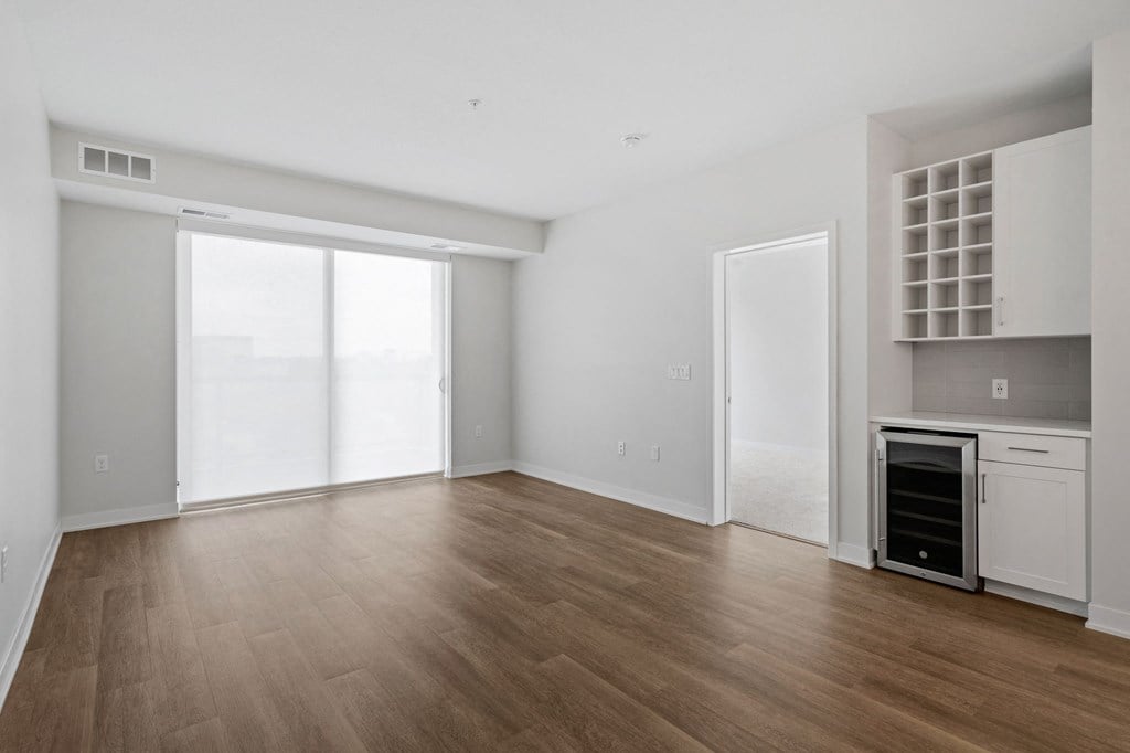 Spacious Living Area With Wood-Style Flooring