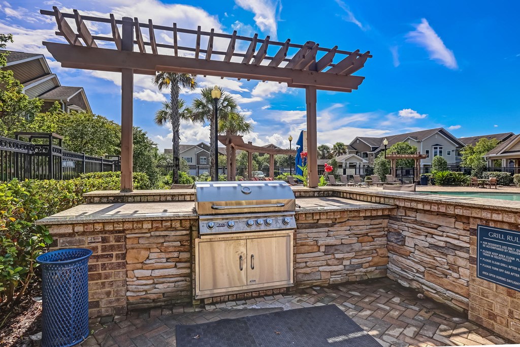 Outdoor Kitchen Area With Pergola