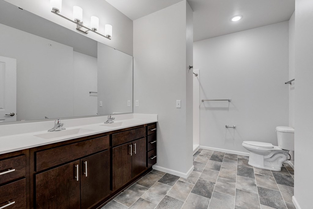 Spacious Bathroom Featuring A Dual Vanity