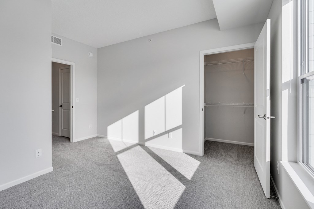 Bedroom Featuring  Lots Of Natural Light & Attached Walk-In Closet