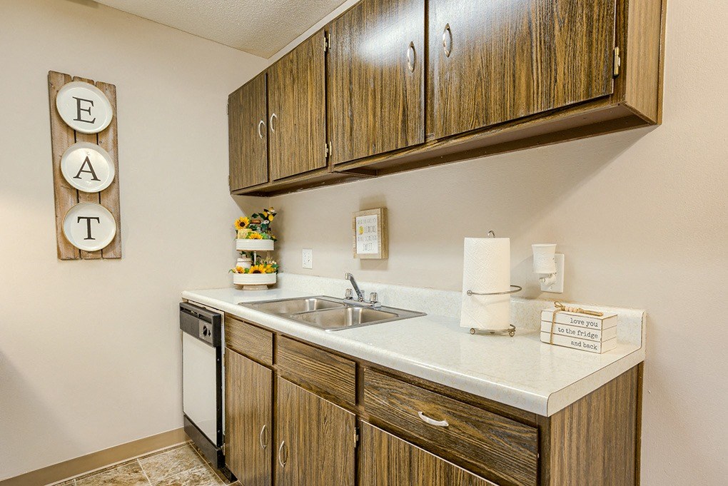our apartments have a kitchen with a dishwasher and a sink