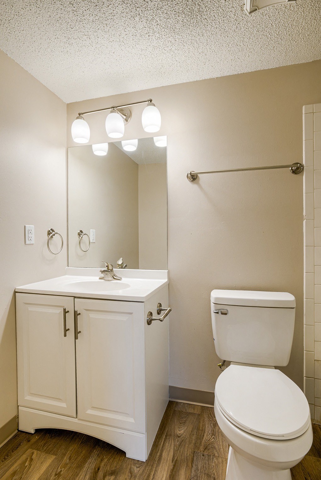 an empty bathroom with a toilet and a sink