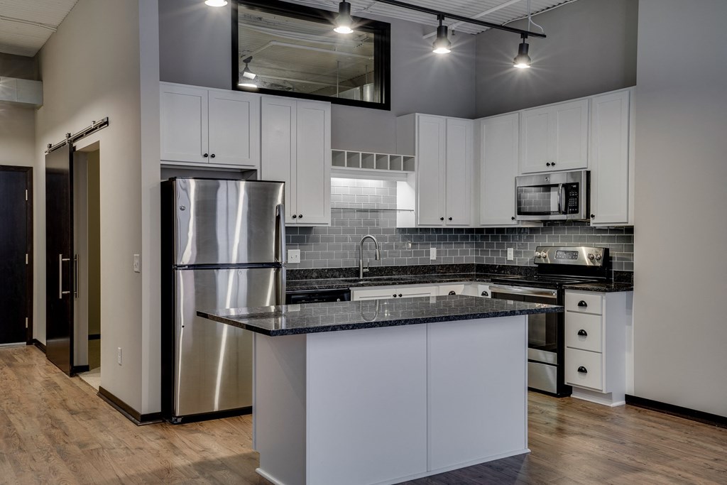 Kitchen with Stainless Steel Appliances and Subway Tile Backsplash